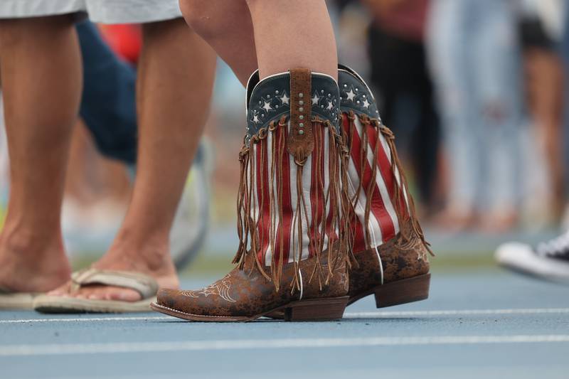A festival goer wears American cowboy boots on day 2 of the Taste of Joliet. Saturday, June 25, 2022 in Joliet.