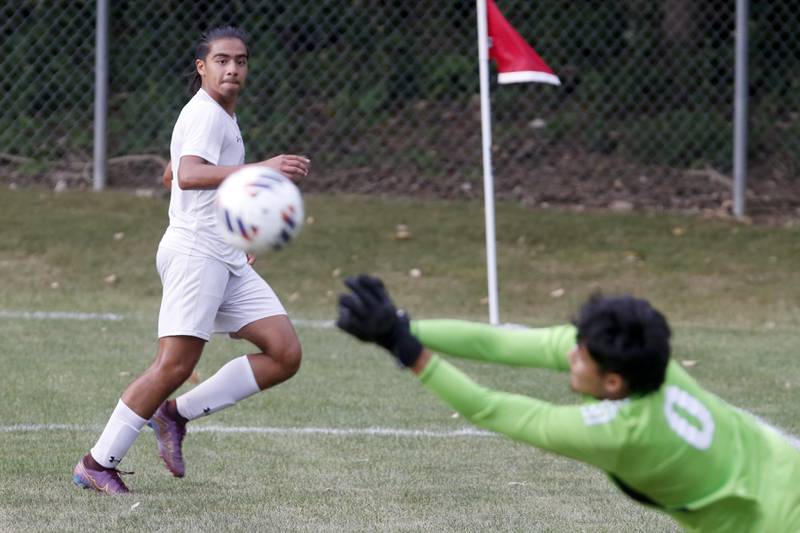 Crystal Lake South's Ali Ahmed watches as Dundee-Crown's Manuel Hernandez punches the ball away from the goal during a Fox Valley Conference soccer match Tuesday, Sept. 5, 2023, at Dundee-Crown High School in Carpentersville.