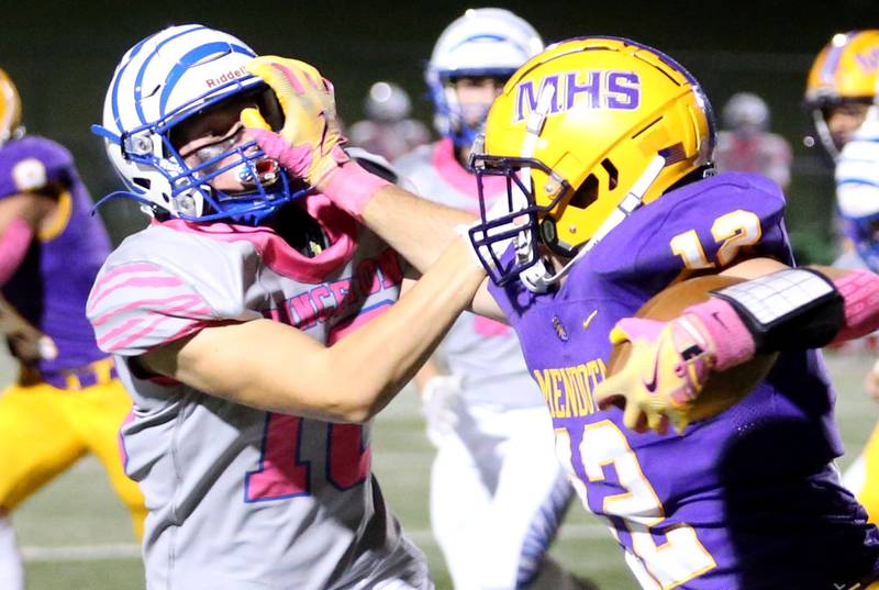 Mendota's Braiden Freeman stiff arms Princeton's Ryan Jagers on Friday, Oct. 11, 2024 at Mendota High School.