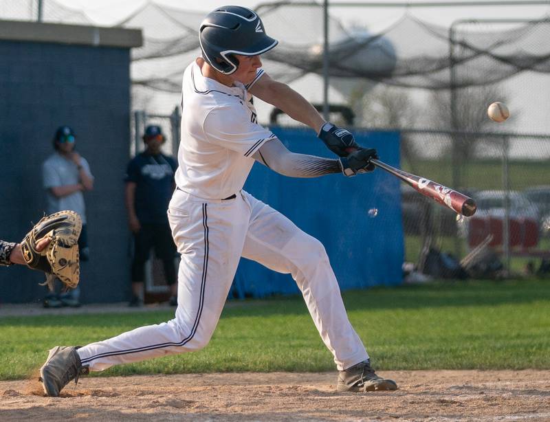 Oswego East's Zachary Polubinski (9) doubles driving in a run against Oswego during a baseball game at Oswego East High School on Tuesday, May 10, 2022.