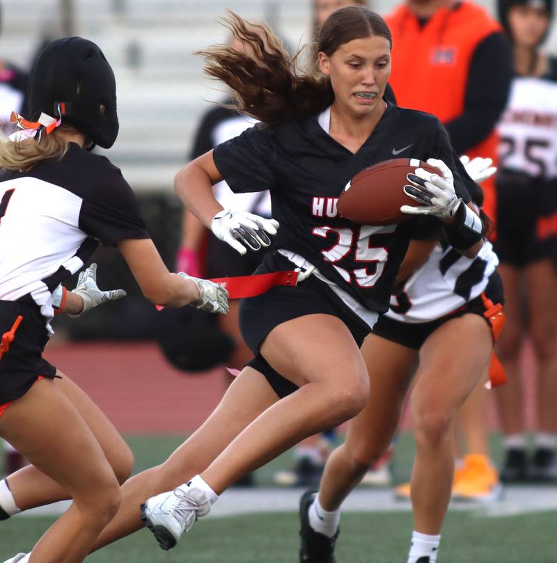 Huntley’s Evelyn Freundt runs the ball against McHenry in varsity flag football at Huntley High School in Huntley on Tuesday, Sept. 9, 2025.