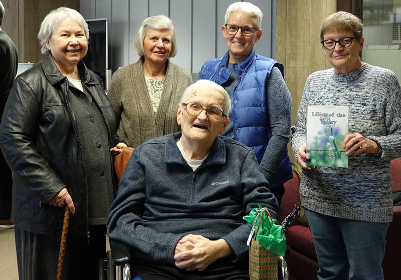 Four members of the La Salle-Peru High School class of 1967 attended the recent ceremony honoring former Illinois Valley Community College and L-P English instructor Ed Krolak (seated). Pam Skoporc (left) Lucy (Krolak) Nauman, Rita (Biolchini) Renwick and Cheryl (Latty) Boldt attended the event in IVCC’s Jacobs Library. It featured IVCC English faculty members reading portions from Krolak’s recent book, “Lilies of the Valley,” a compilation of his newspaper columns and essays. Dozens of former colleagues, students, family and friends attended the ceremony. His 40-year teaching career included a year in England as part of the prestigious Fulbright Teacher Exchange.