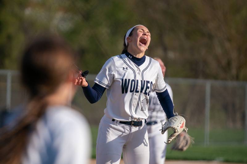 Oswego East's Nicole Stone (16) reacts during the end of a softball game after defeating Oswego at Oswego East High School on Friday, April 21, 2023.