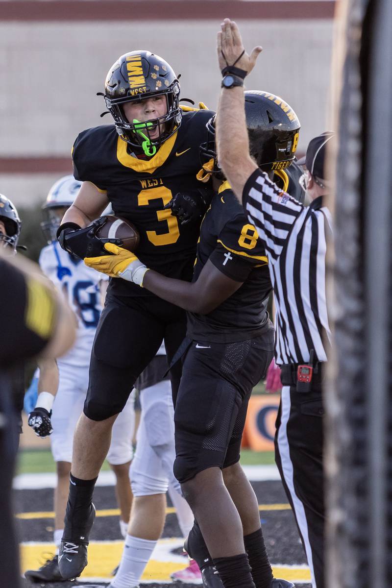Joliet West's James Koulis celebrates after scoring a touchdown during a varsity football home game against Plainfield South on Sept. 12, 2025.