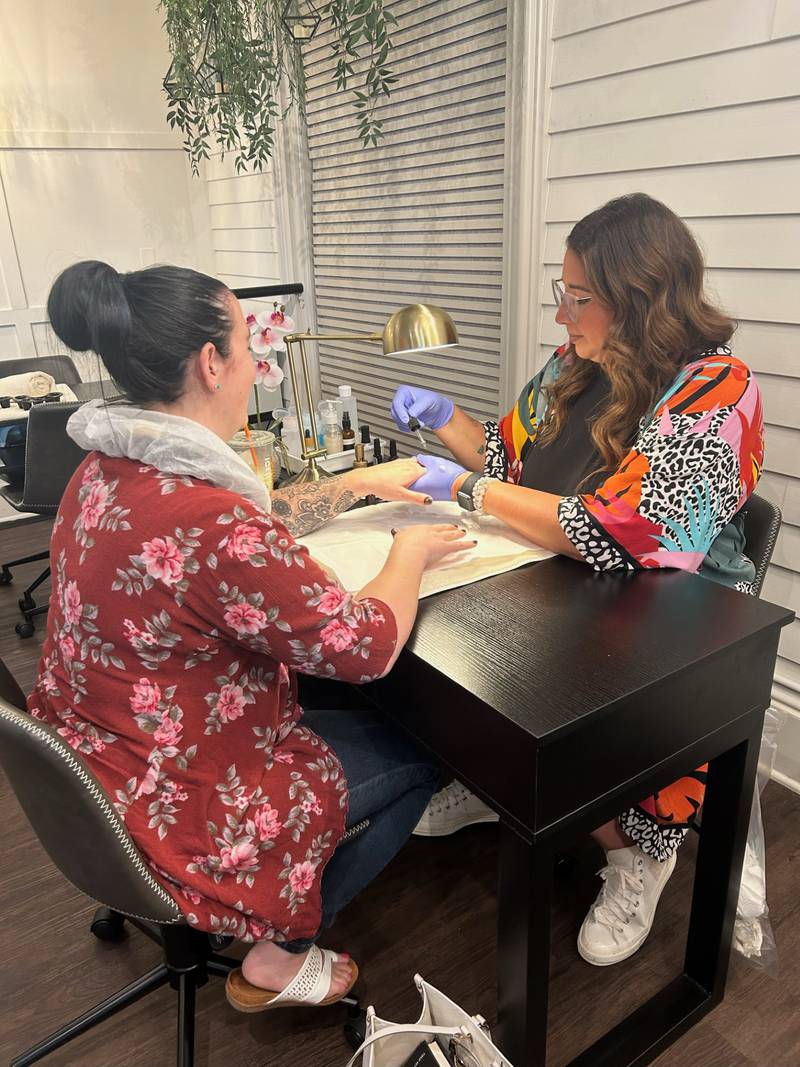 Hailey Conran, co-owner of On Point Nails, at 328 S. Third St., Geneva, does a manicure for a client. The new nail salon opened in February.