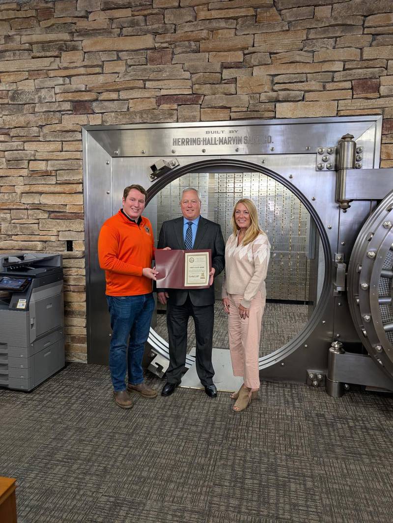 State Rep. Brad Fritts (from left) presents his monthly business highlight award to Kirk Ross, president and CEO, and Jan Phalen, Chief Marketing Officer.