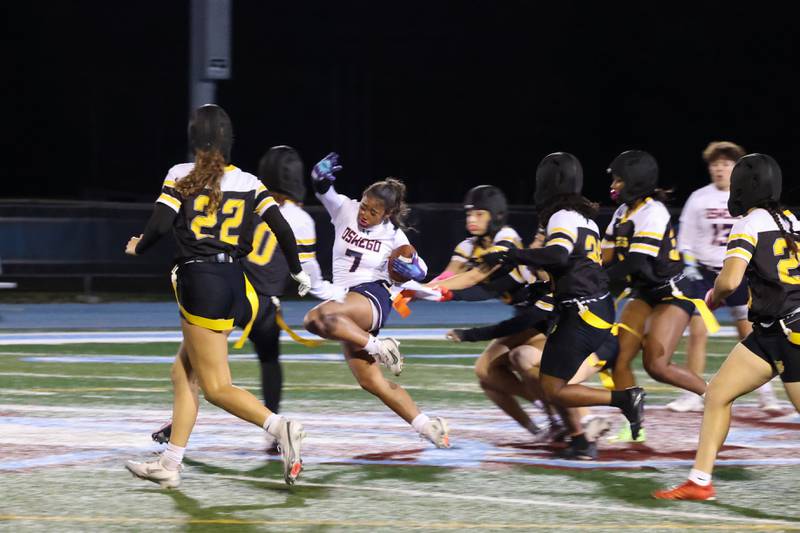 Oswego's Alexis Fomby runs the ball through Joliet West defenders during the Panthers' 13-7 victory over Joliet West on Tuesday, Oct. 7, 2025.