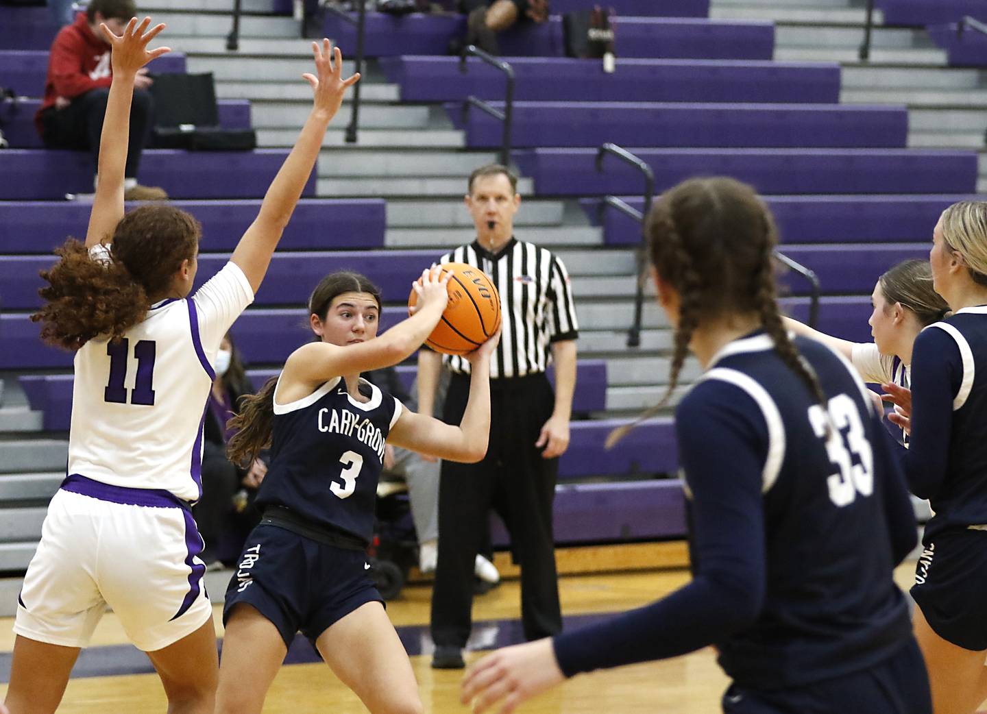 Cary-Grove's Kennedy Manning looks to pass the ball as she is guarded buy Hampshire's Mikala Amegasse during a Fox Valley Conference girls basketball game on Monday, Dec. 9, 2024, at Hampshire High School.