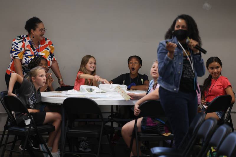 Students from Pioneer Elementary, in Bolingbrook, play trivia BINGO highlighting black women in history at the Juneteenth event hosted by the Joliet Area Historical Museum on Monday, June 19, 2023 in Joliet.