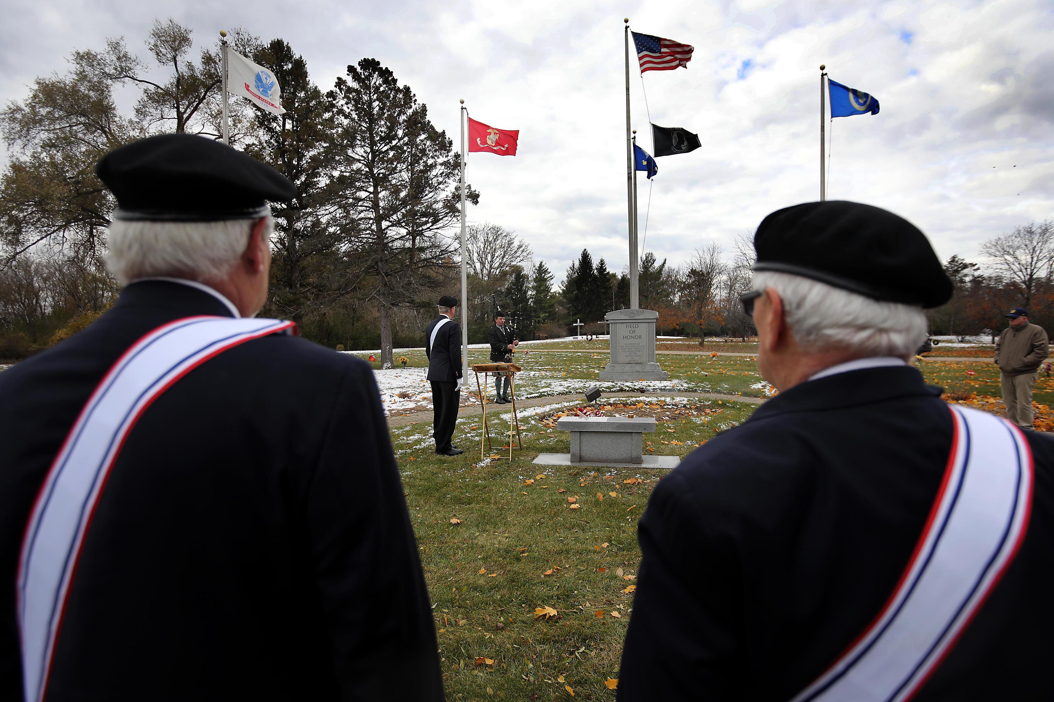 Members of the Knights of Columbus participate in the Veterans Day flag placement ceremony Tuesday, Nov. 11, 2025, at the gravesites of veterans at McHenry County Memorial Park Cemetery in Woodstock. Members of the Knights of Columbus Patriotic 4th Degree from the Bishop Boylan Assembly placed American Flags at nearly 140 veterans' grave markers.