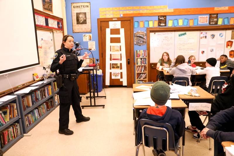 St. Charles Police Officer Meghan Kramer works with fifth-graders at Lincoln Elementary School in St. Charles.