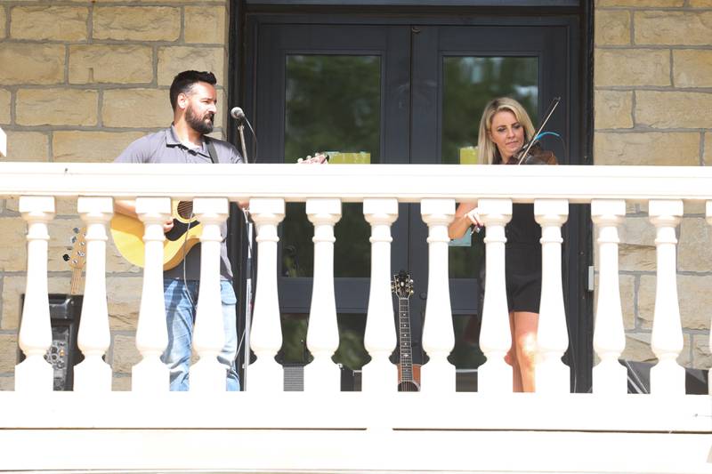 Anne Hatfield-Martin performs on the balcony of USF Motherhouse. The Upper Bluff Historic District hosted Porch & Park Music Fest featuring a variety of musical artist at five different locations. Saturday, July 30, 2022 in Joliet.