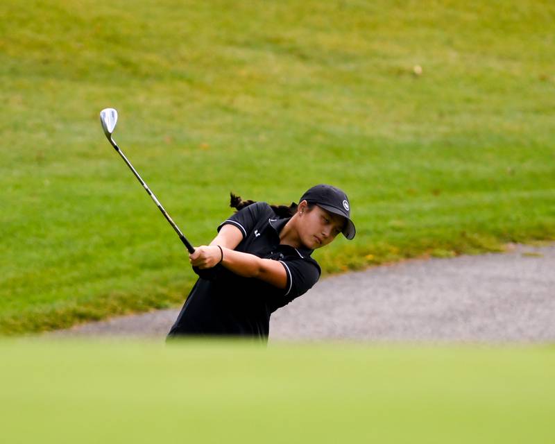 Angelina Nguyen hits her ball during the DuKane conference meet on Tuesday Sept. 23, 2025, held at Phillips golf course in Aurora.