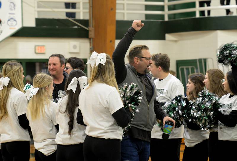 Glenbard West parent Eric Pierce is among the parents entering Biester Gym to celebrate the boys basketball team taking home a state win during the pep rally held Sunday March 13, 2022.