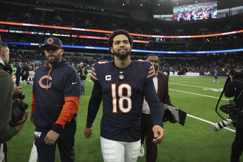 Chicago Bears quarterback Caleb Williams (18) leaves the field after an NFL football game at the Tottenham Hotspur stadium between the Jacksonville Jaguars and Chicago Bears in London, Sunday, Oct. 13, 2024. (AP Photo/Ian Walton)