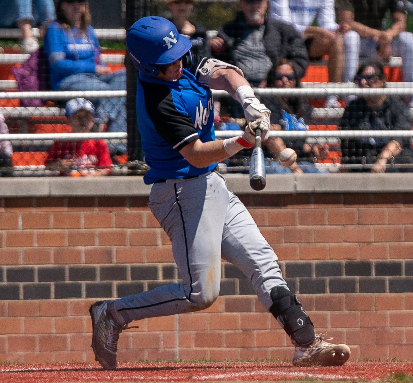 St. Charles North's Jayden Lobliner (4) singles against St. Charles East during a baseball game at St. Charles East High School on Saturday, May 7, 2022.