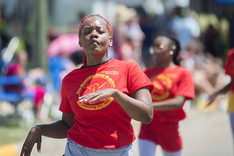 A member of the New Generation Fancy Drill Team performs Sunday, July 3, 2022 in the Petunia parade.