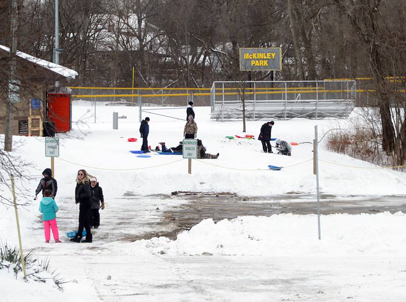 Children gather at McKinley Park on Thursday, Feb. 3, 2022 in Peru. Many schools were out for a second day after several inches of snow fell across the region.
