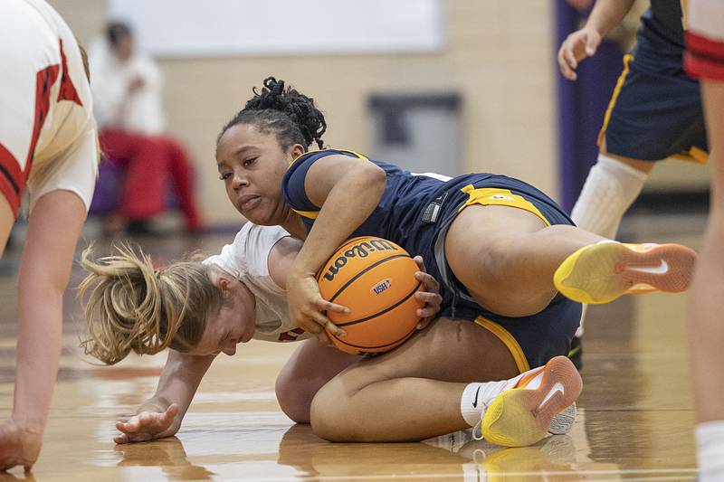 Sterling’s Joslyn Green and Stillman Valley’s Sydney Musial fight for a loose ball Saturday, Dec. 27, at the Duchesses Basketball Christmas Classic.