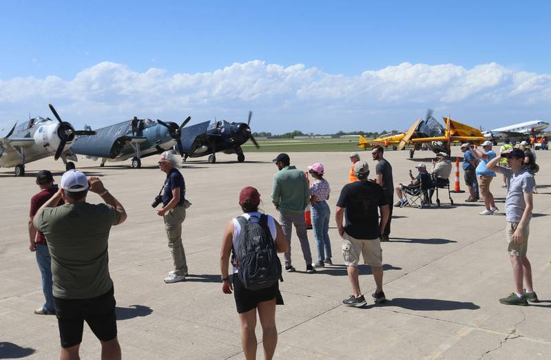 People gather as TBM aircrafts depart during the 10th annual TBM Avenger Reunion and Airshow on Friday, May 16, 2025 at the Illinois Valley Regional Airport in Peru.