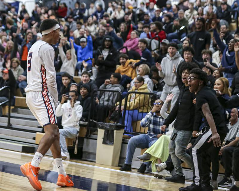Oswego's Ethan Vahl (3) address the student section after scoring a basket while being fouled during their basketball game between West Aurora at Oswego Monday, Nov 24, 2025 in Oswego.