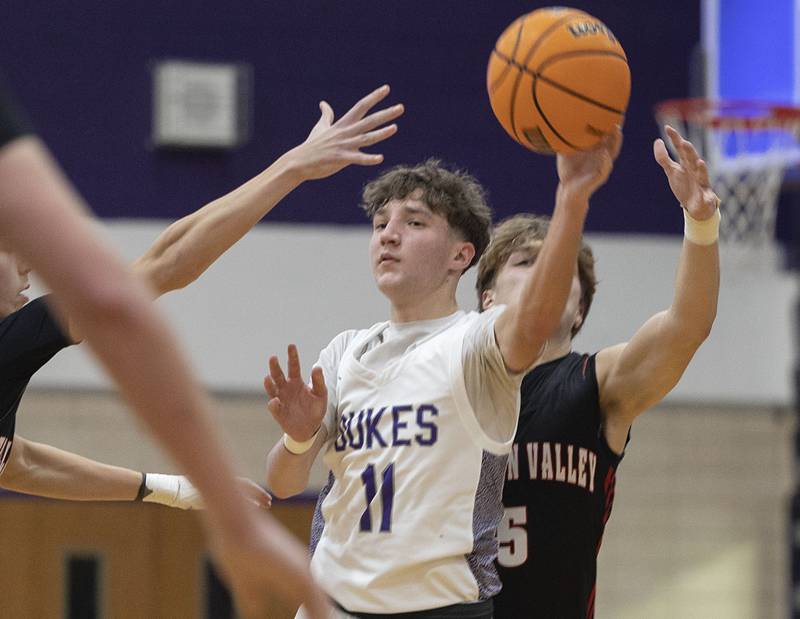 Dixon’s Brody Nicklaus passes out of defense against Stillman Valley Friday, Jan. 9, 2026.