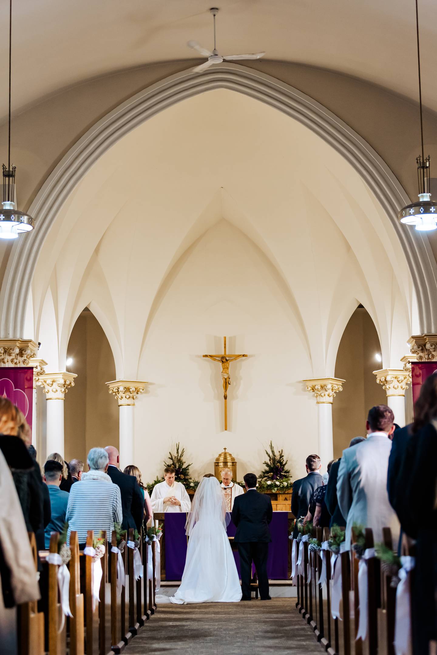 Lockport native Abigail Rodewald Brown was the fifth generation of women in her family to get married at St. Joseph Catholic Church in Lockport. She is pictured at the church’s altar with her husband William Brown on their wedding day, Saturday, Dec. 2, 2022.