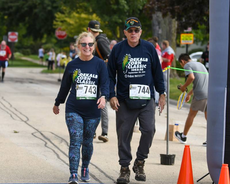 Brendon Wilson and wife Kay Wilson of DeKalb finish the DeKalb Corn Classic 5K/10K race on Sunday, Sept. 29, 2024, held in downtown DeKalb.