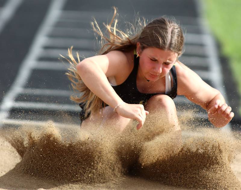 Harvard’s Olivia Nulle competes in the long jump during  KRC Conference Track Meet action at Marengo High School in Marengo on Tuesday, May 6, 2025.