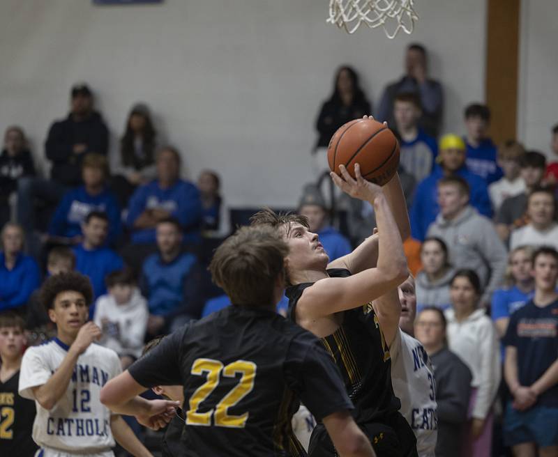AFC’s Noah Danielson puts up a shot against Newman Monday, Feb. 19, 2024 in a regional quarterfinal game at Newman High School.