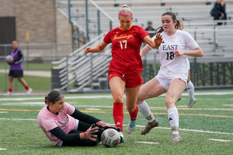 Oswego East's Catherine Karmik (0) makes a save against Batavia’s Natalie Warner (17) during a soccer match at Batavia High School on Saturday, March 29, 2025.