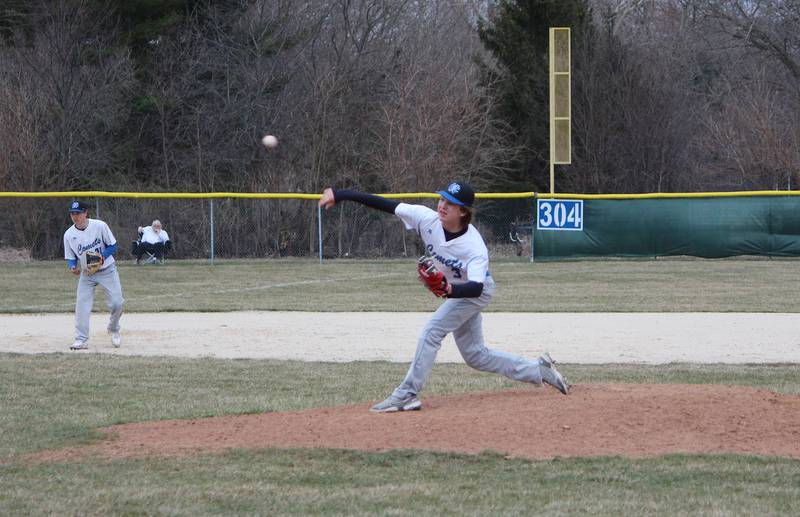Newman's Garet Wolfe fires a pitch in the seventh inning against Kewanee on Thursday, March 30, 2023 during their Three Rivers East game in Sterling.