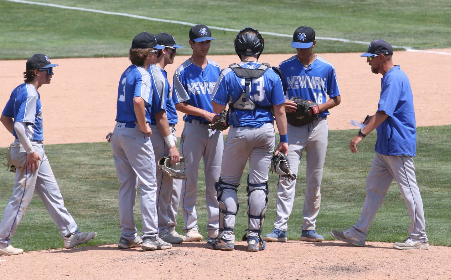 Newman head baseball coach Kenny Koerner talks to his team during the Class 1A State semifinal game on Friday, June 2, 2023 at Dozer Park in Peoria.