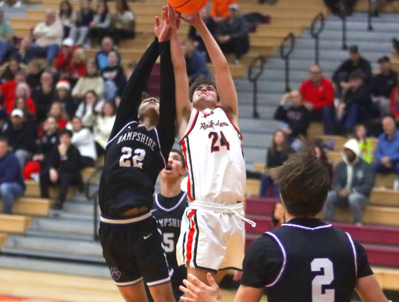 Huntley’s  Casey Kaczmarski, right, battles Hampshire’s Jaiden Baldwin in varsity boys basketball on Friday, Dec. 19, 2025, at Huntley High School in Huntley.