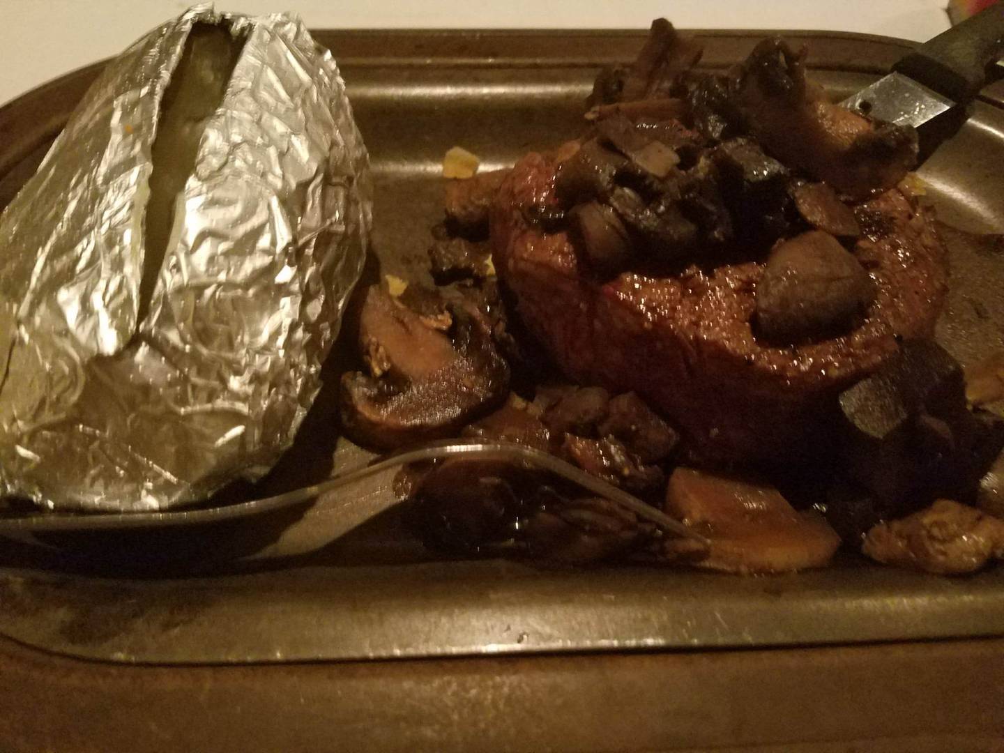 A steak and baked potato is seen at Syl's Restaurant in Rockdale in 2016.