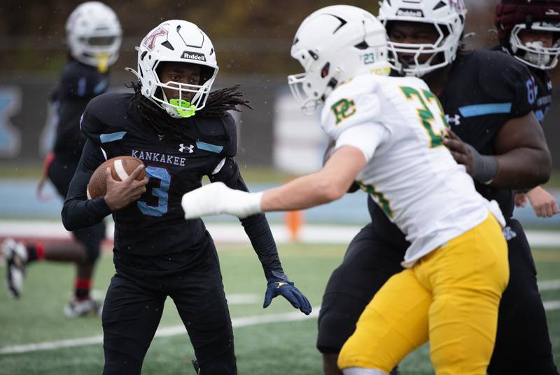 Kankakee's Cedric Terrell runs the ball on a play in a Class 5A playoff against Providence Catholic on Saturday, November 8, 2025.