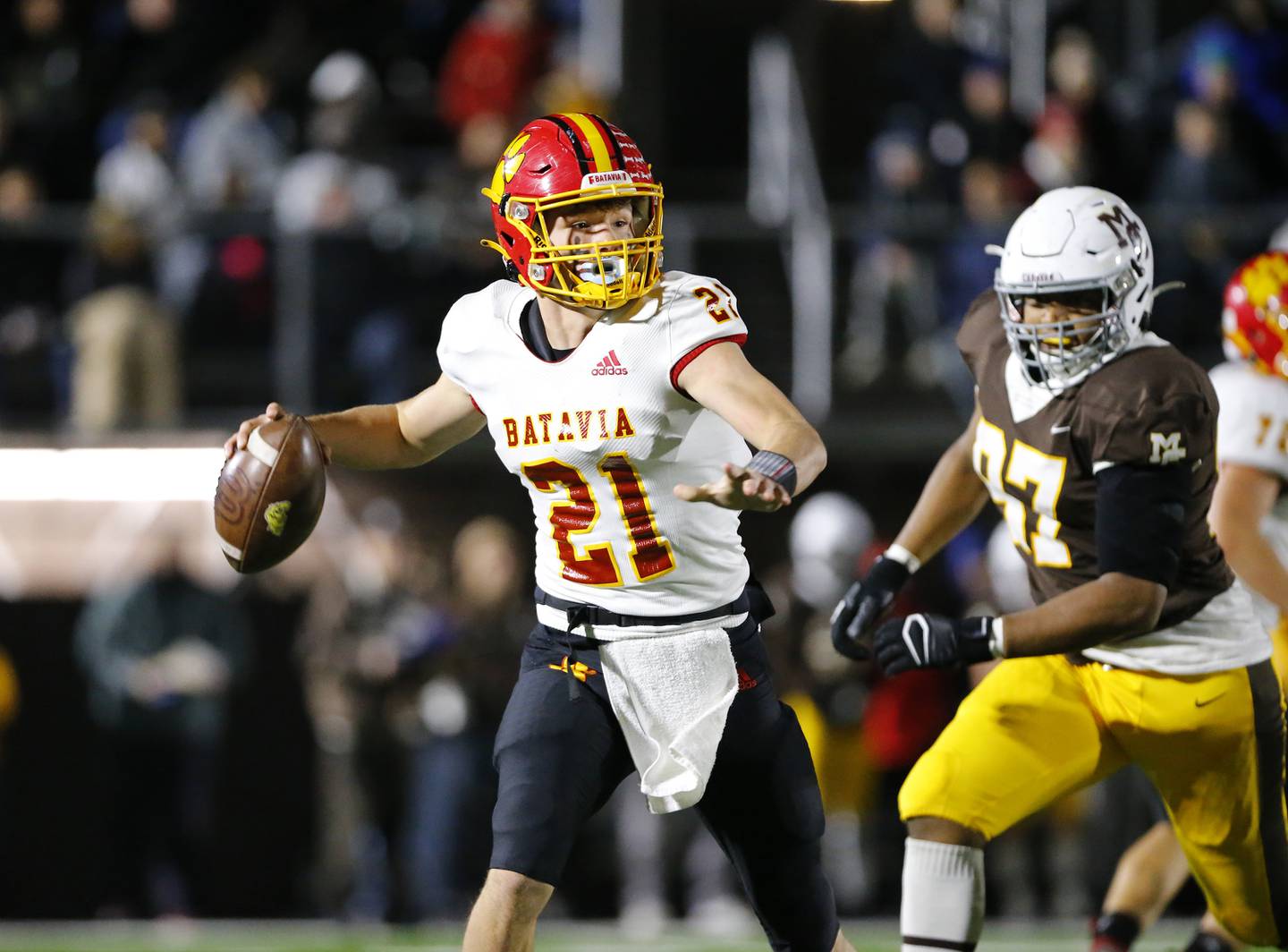 Batavia's Ryan Boe looks for a receiver during the IHSA Class 7A  varsity football playoff game between Batavia and Mt. Carmel on Friday, November 5, 2021 in Chicago.