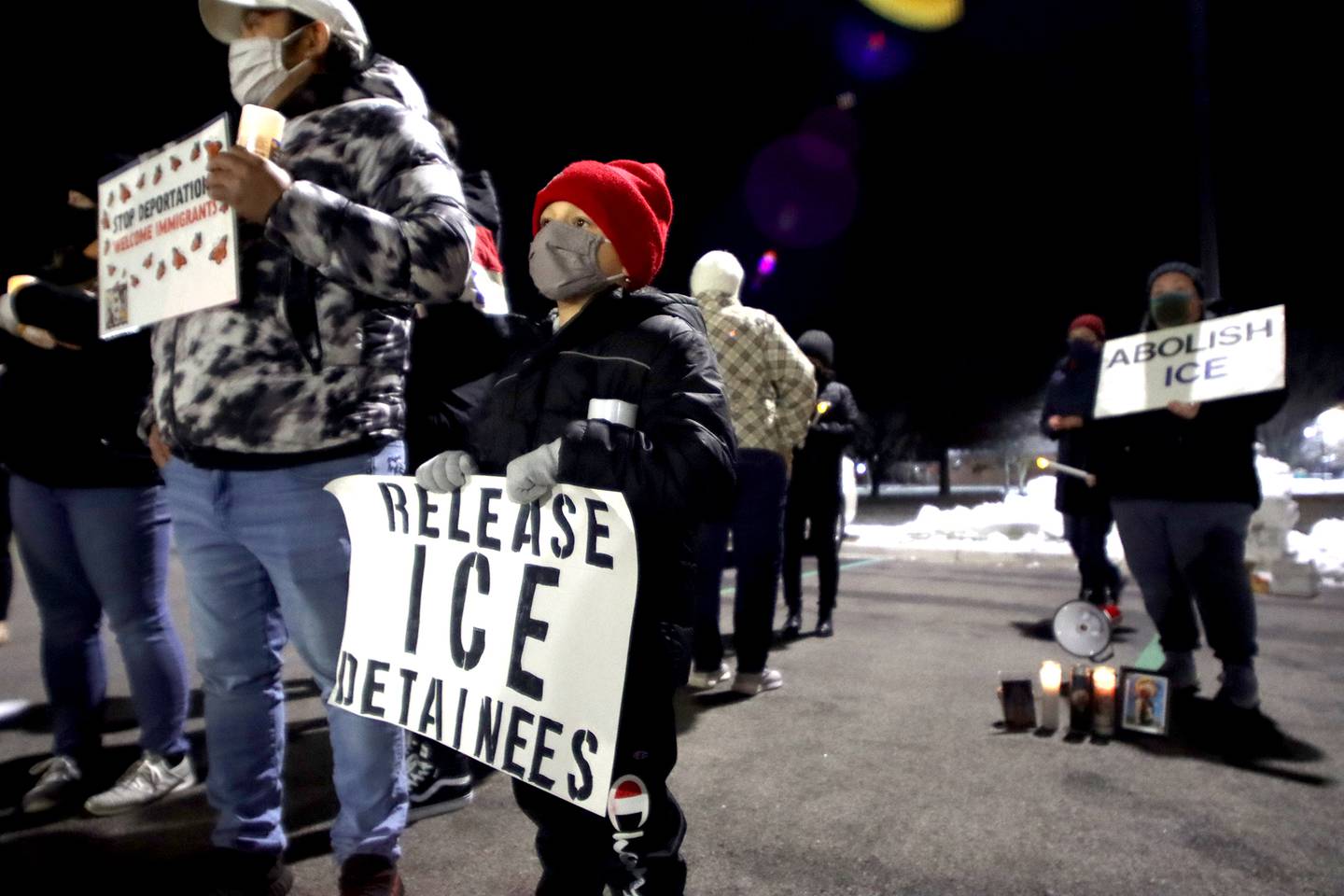 Alexander Elizarraraz, 6, prepares to walk with fellow activists to the front of the McHenry County Correctional Facility the evening of Wednesday, Dec. 29, 2021. Alexander’s dad, former detainee Cesar Elizarraraz, spoke to those gathered as part of the event arranged by the Coalition to Cancel the ICE Contract in McHenry County.