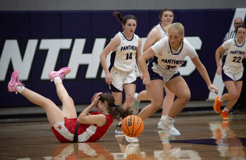 Manteno's Kendall Blanchette, right, attempts to recover a steal as Streator's Audrey Arambula, left, goes down in a game on Monday, December 8, 2025.