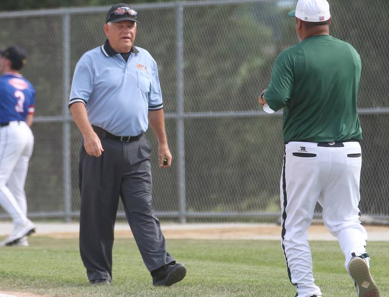 Umpire Dan Wieczorek walks down the first base line during the ICA Senior Baseball All Star Game on Monday, June 30, 2025 at Schweickert Stadium in Peru.