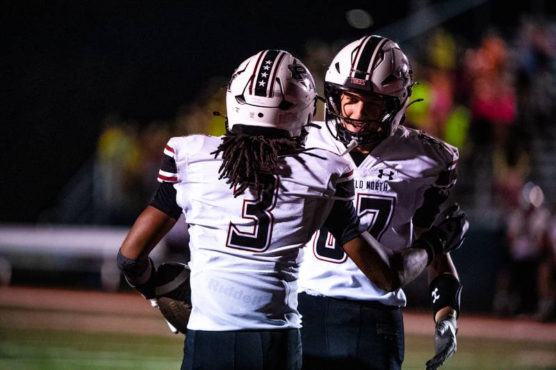 Plainfiled North's Mariell Macon and Jonnie Laurenti celebrate during a game against Romeoville on Friday Sept. 19, 2025 at Romeoville High School