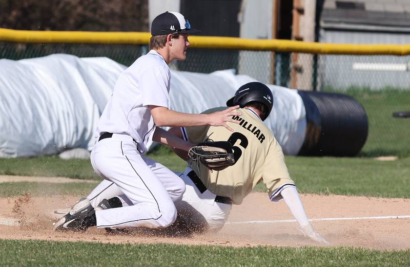 Kaneland's Matthew Brunscheen takes the throw as Sycamore's Conner Williar slides safely into third during their game Thursday, May 4, 2023, at Kaneland High School.