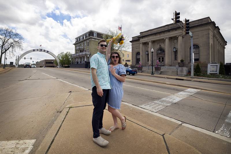 Newly engaged couple Riley Dixon and Emma Walsh celebrate near the Dixon arch Saturday, April 27, 2024.