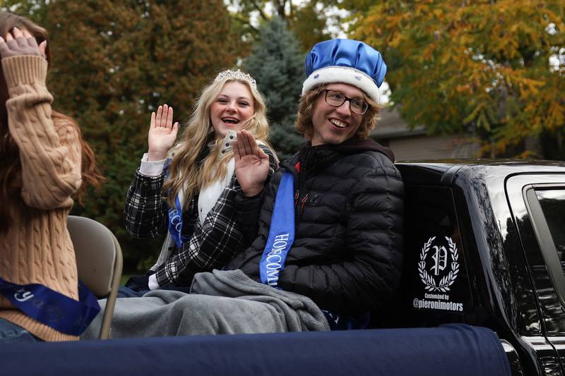 Plainfield South Royalty Alexa Worthley and Eoan Henes wave to the crowds in the 70th Annual Plainfield Homecoming Parade. Saturday, Oct. 8, 2022, in Plainfield.