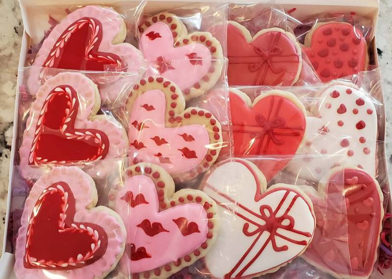 Cute and snuggly, sweet and yummy lovebird cookies are just some of the offerings from The Crafty Piper, a local cottage bakery in Sugar Grove that creates custom-decorated cookies.