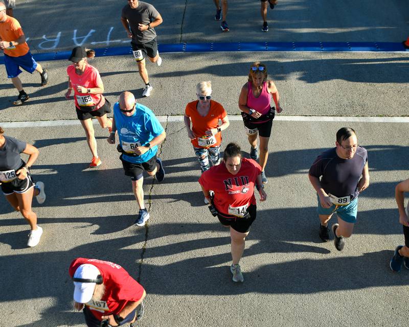DeKalb Corn Classic 10K racers take off during the start of the race on Sunday, Sept. 29, 2024, held in downtown DeKalb.