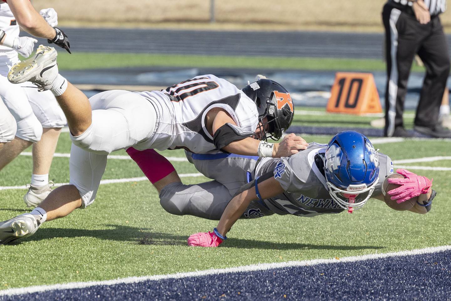 Newman’s Rylan Alvarado reaches for the goal line against Kewanee Saturday, Oct. 18, 2025. A penalty negated the gain.