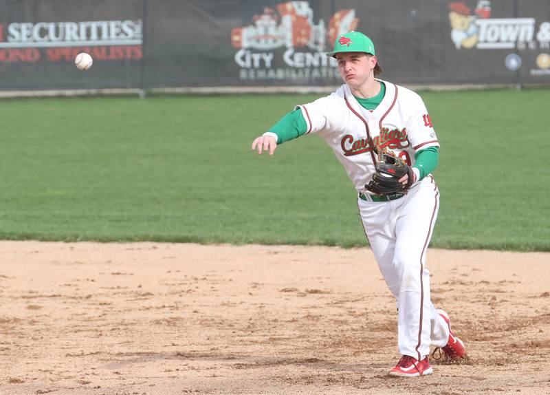 L-P's Billy Mini throws to first base to throw out a Kaneland runner on Wednesday, April 5, 2023 at Dickinson Field in Oglesby.