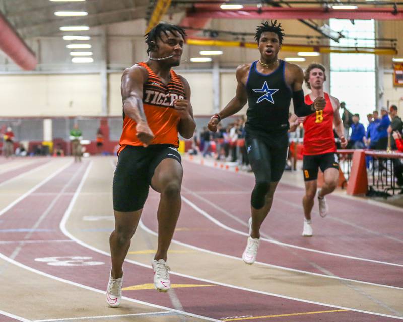Wheaton Warrenville South's Da'jion Riley finishes in front of St. Charles North's Ayodele Bateye and Batavia's Nathan Whitwell in the 55 meters during DuKane Boys Indoor Track and Field Conference Championships. Mar 16, 2024
