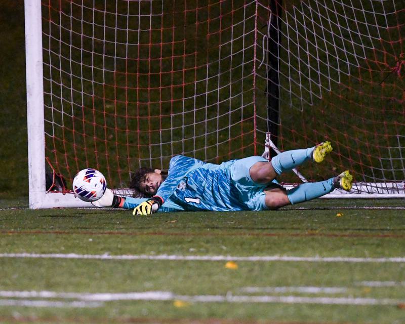 Benet Academy's Patrick Stasch (1) blocks the ball on a penalty kick while taking on Prairie Ridge during the class 2A super sectional soccer match on Tuesday Nov. 5, 2024, held at Wheaton Academy in West Chicago.